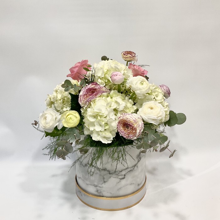 Box with fresh flower arrangement
